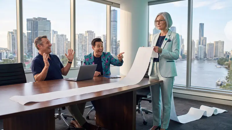 Dot, the AI coach, holds up an absurdly long blank receipt that runs off the boardroom table, while the owner laughs with his hands up and Buddy points at it.