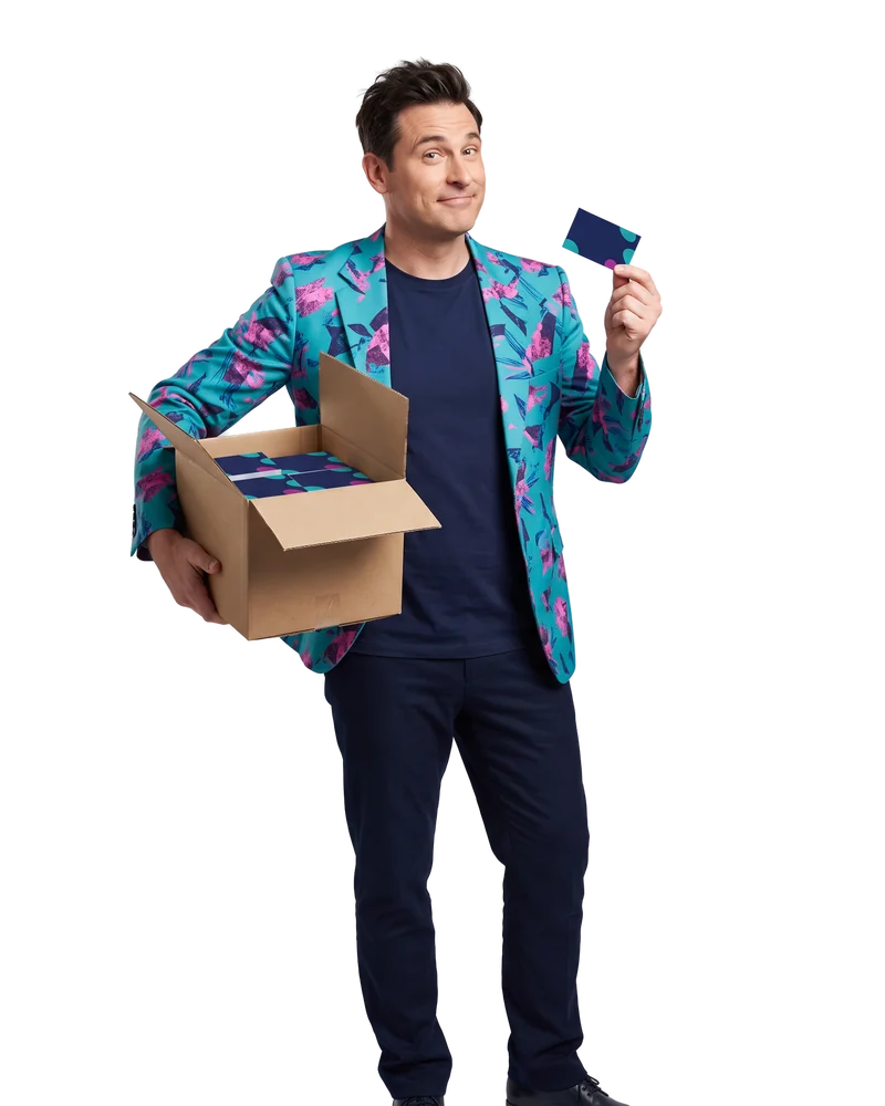 Buddy holding an open box of freshly printed business cards